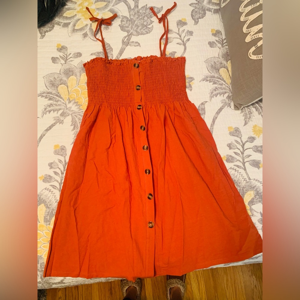Dark orange smocked dress with wooden buttons (functional)